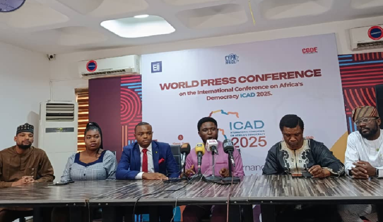 Chris Iyama at the ICAD 2025 pre-conference briefing, addressing African democracy and development