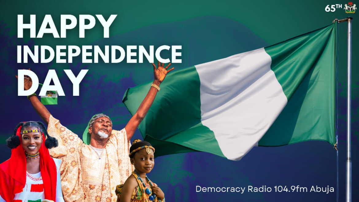 Nigerian flag waving during 65th Independence anniversary celebration in Abuja.