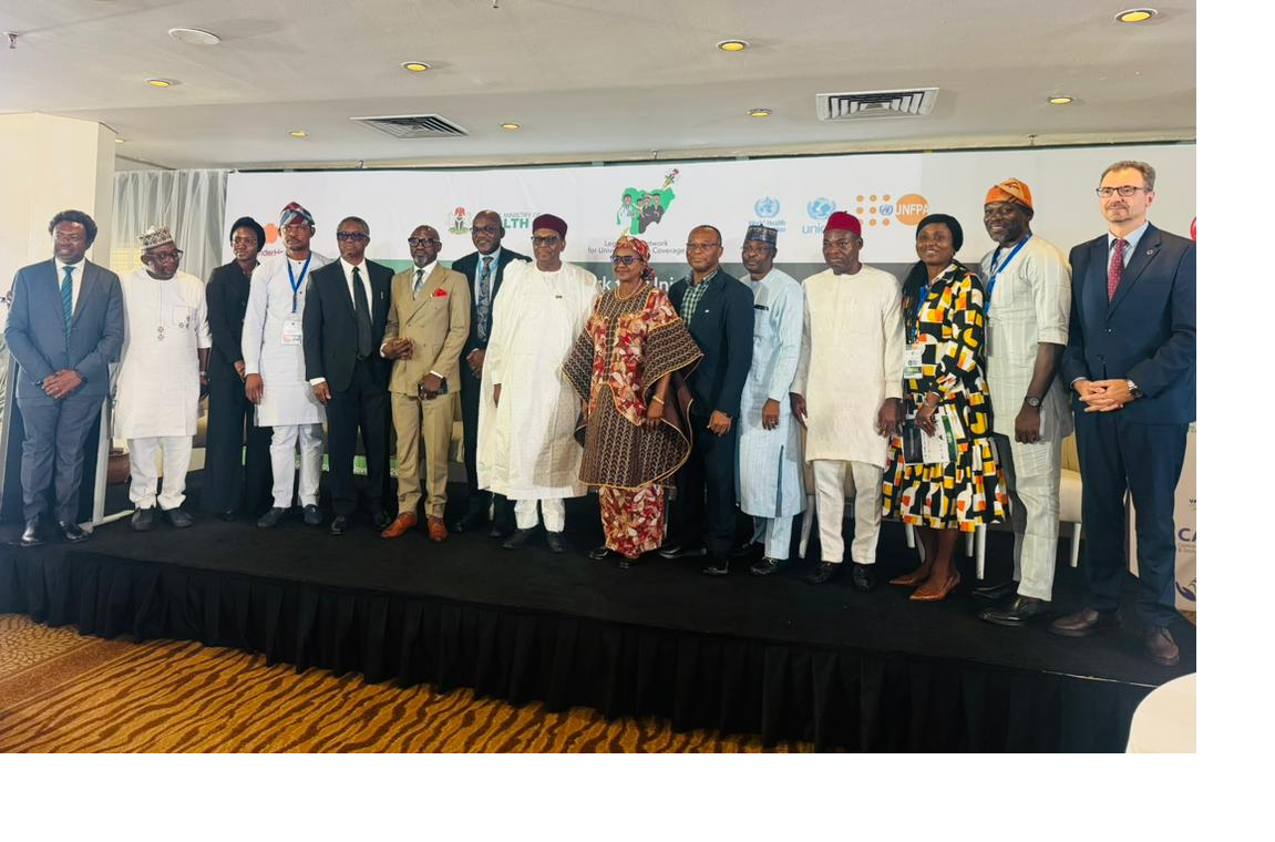 Dr. Pavel Ursu and Senator Ipalibo Banigo discuss digital health reforms and universal health coverage at a national summit in Abuja.