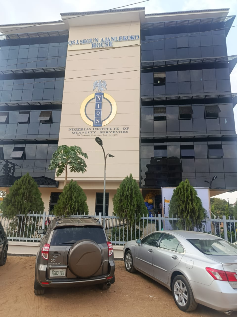 NIQS Abuja headquarters renamed in honour of QS Segun Ajanlekoko during a ceremony calling for stronger construction regulation and professional standards in Nigeria.