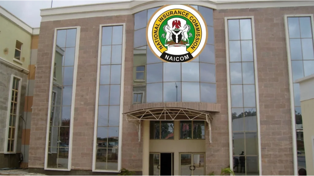 NAICOM officials at the opening of Insurance Week 2026 in Abuja discussing insurance sector reforms