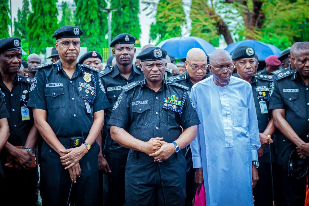 Olatunji Disu pays tribute to 17 Police Mobile Force officers killed in a Yobe State terrorist attack at a memorial parade in Abuja.