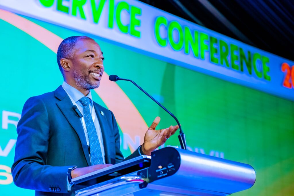 Oluwaseun Faleye announcing that over 7.6 million employees, including members of the Nigeria Police Force, have been enrolled in the Employees’ Compensation Scheme in Abuja.