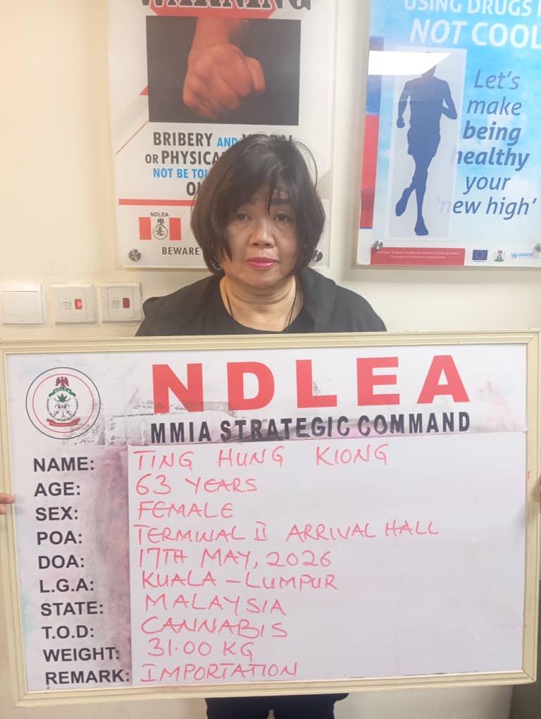 NDLEA officials at Murtala Muhammed International Airport in Lagos during the arrest of a suspected drug trafficker linked to an attempted cannabis smuggling case.