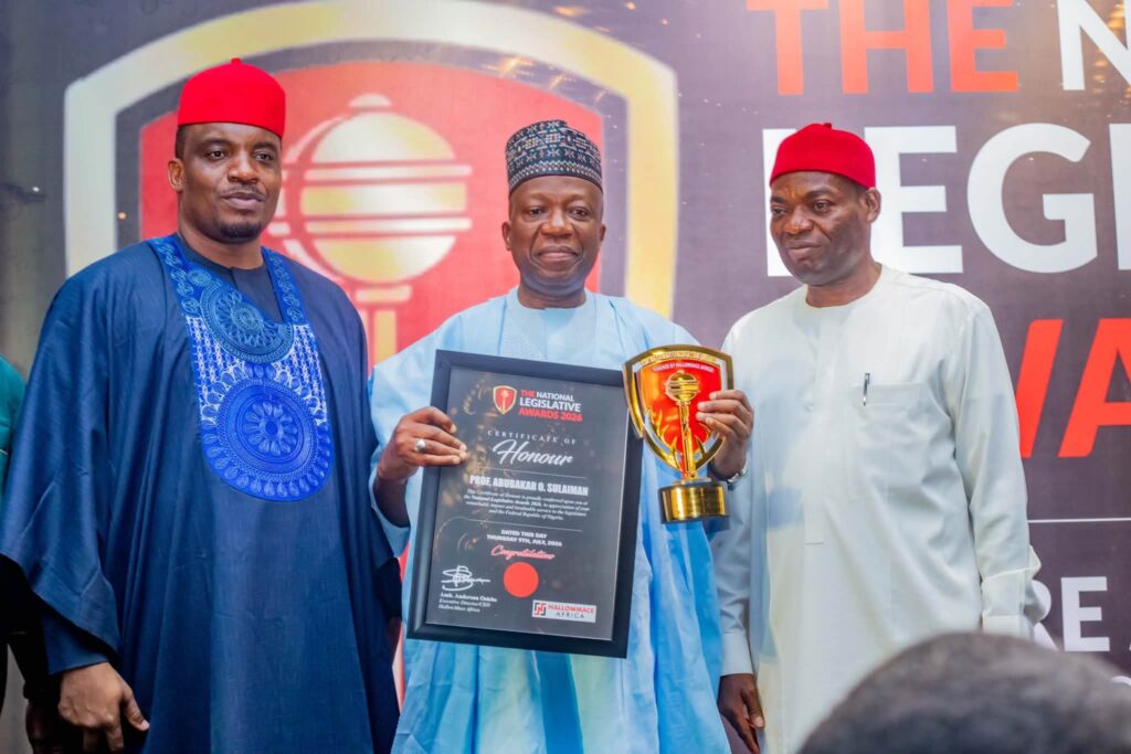 Professor Abubakar Sulaiman, NILDS Director General, receiving recognition for contributions to legislative and democratic development.