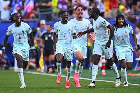 France players celebrate after defeating Morocco 2-0 in the 2026 FIFA World Cup quarter-final at Boston Stadium to reach the semi-finals.