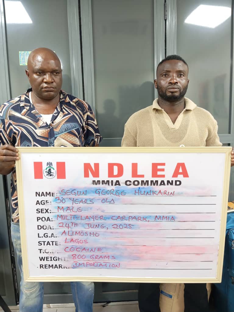 NDLEA officials escort convicted drug traffickers after a Federal High Court in Lagos sentenced them over cocaine importation.