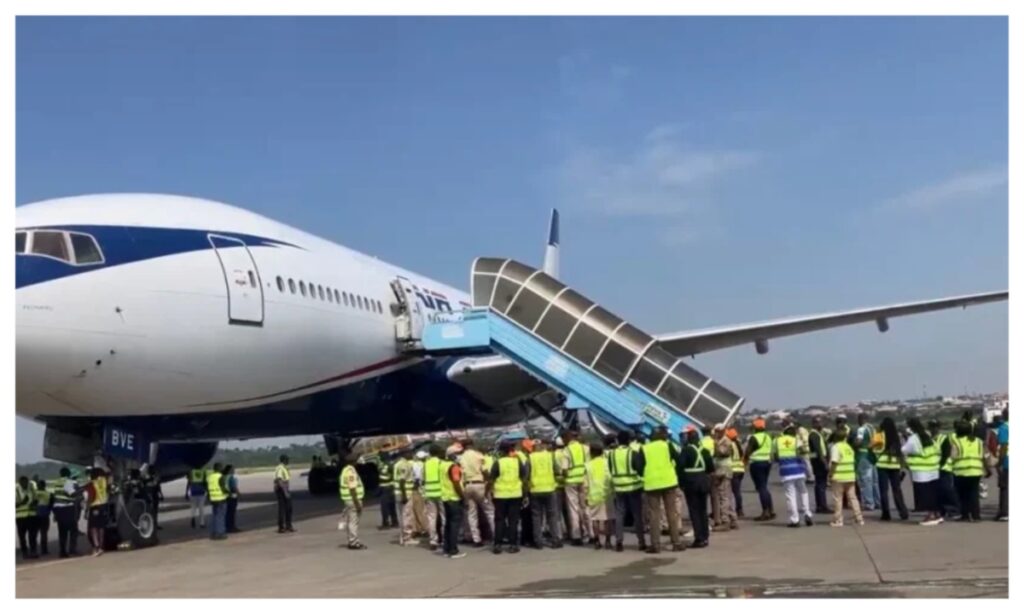 Nigerian returnees arriving at an airport after being evacuated from South Africa following xenophobic attacks.