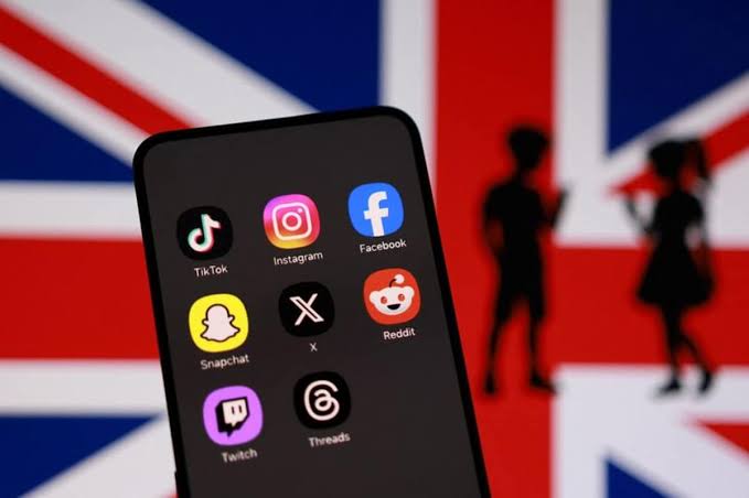 A teenager using a smartphone at night as the UK announces an overnight social media curfew for 16 and 17-year-olds.