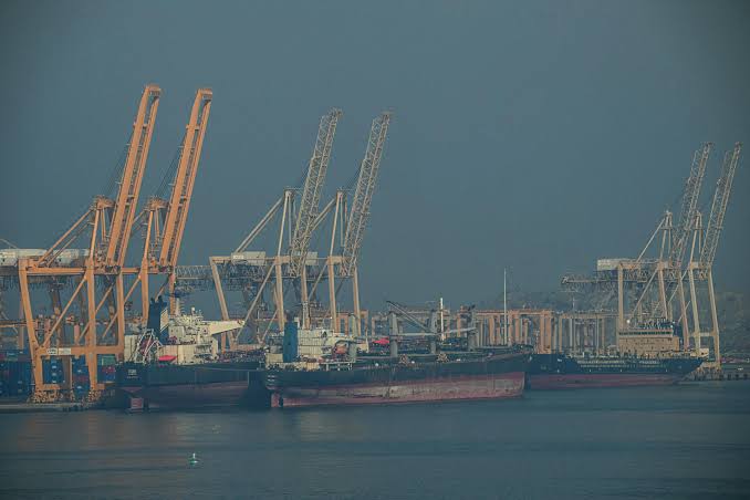A cargo ship passing through the Strait of Hormuz as Iran's Revolutionary Guard announces continued closure amid tensions with the United States.