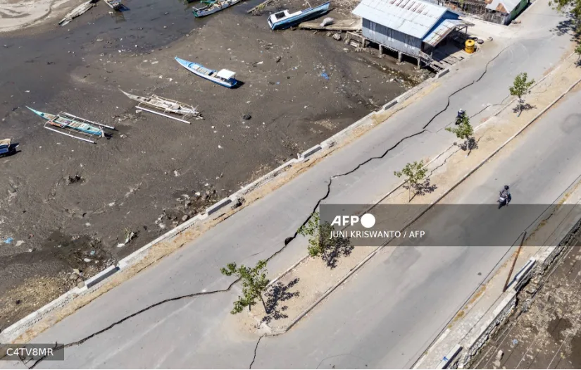 Residents displaced by a powerful earthquake camp outside their homes on Indonesia’s Flores Island.