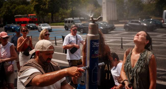 People in Germany seek shade and relief from intense summer heat.