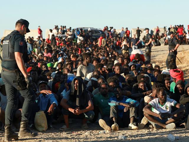 Migrants gather in Ceuta after crossing from Morocco