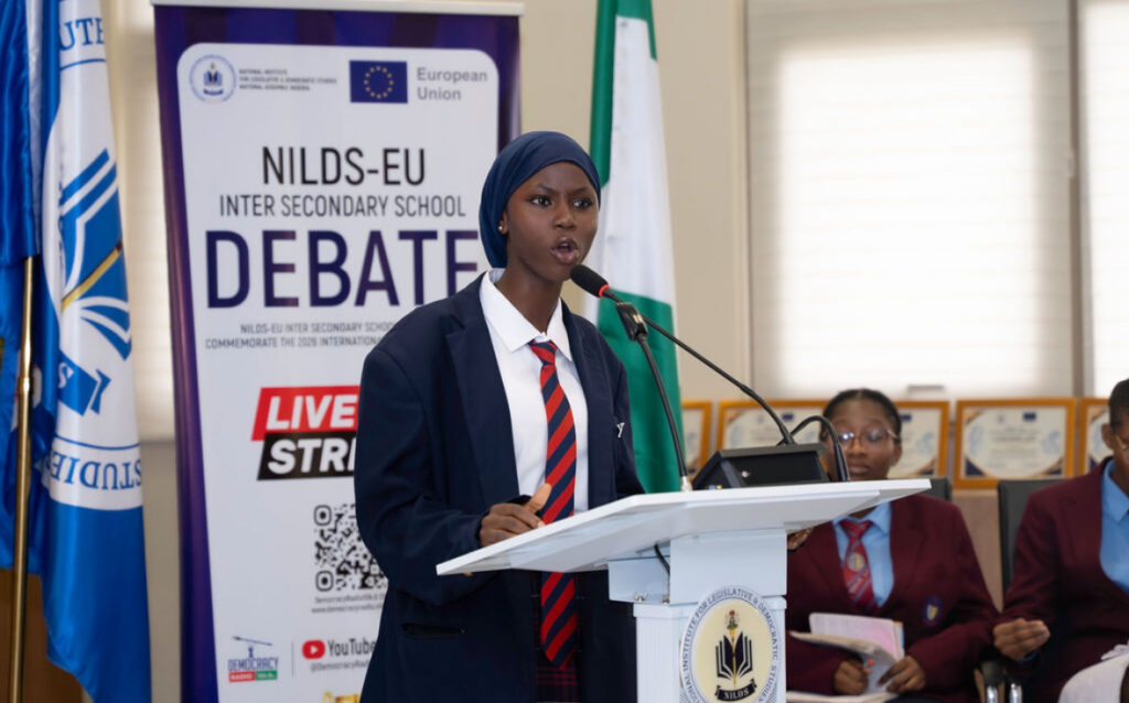 Janga Fatima of Pacesetters Academy, Wuye, participates in the NILDS-EU inter-secondary school debate in Abuja.